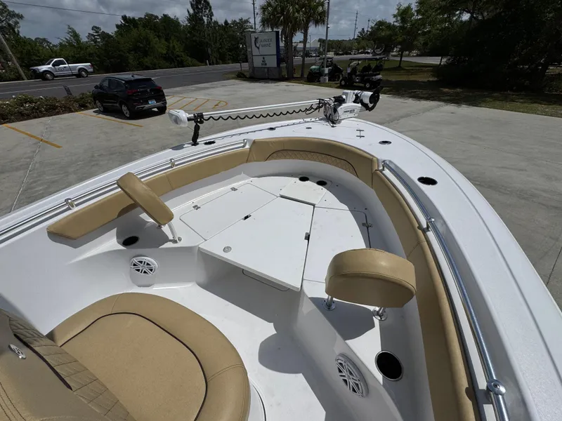 Slide: The Image of 2023 Sportsman Open 212 Center Console boat with tan seating and spacious deck. - 21