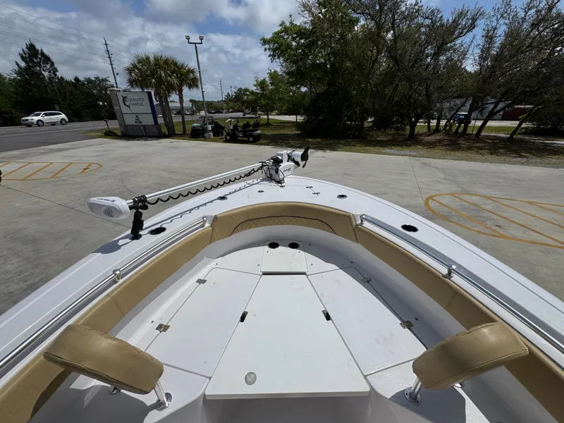 Slide: The Image of 2023 Sportsman Open 212 Center Console boat, bow view, parked outdoors. - 22