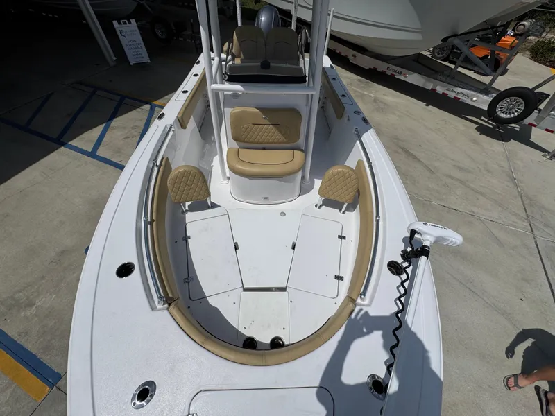 Slide: The Image of 2023 Sportsman Open 212 Center Console boat with spacious deck and seating. - 23