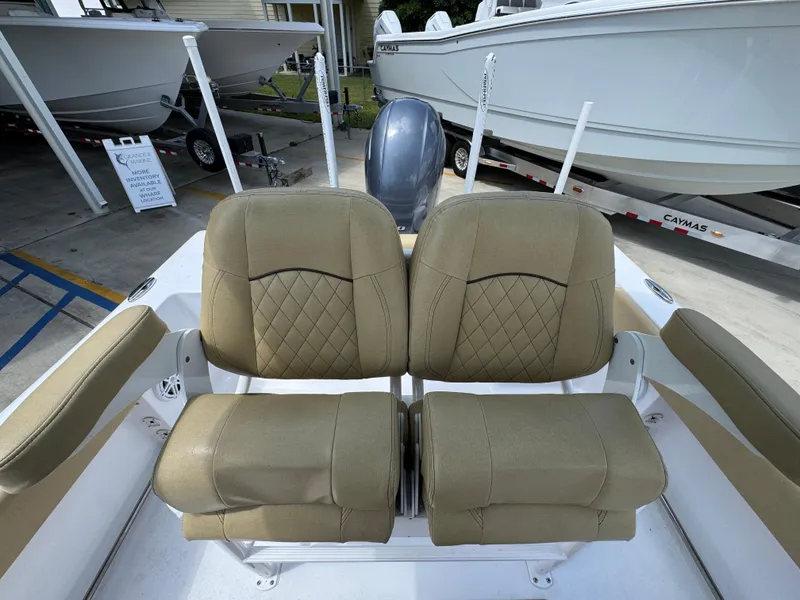Slide: The Image of 2023 Sportsman Open 212 Center Console boat with tan cushioned seating. - 31