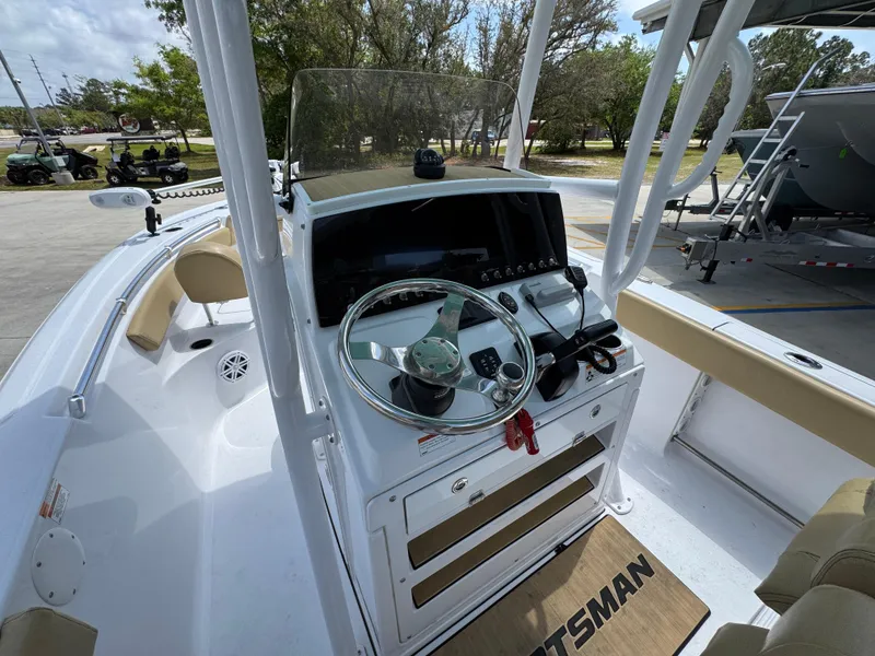 Slide: The Image of 2023 Sportsman Open 212 Center Console boat interior with steering wheel and controls. - 32
