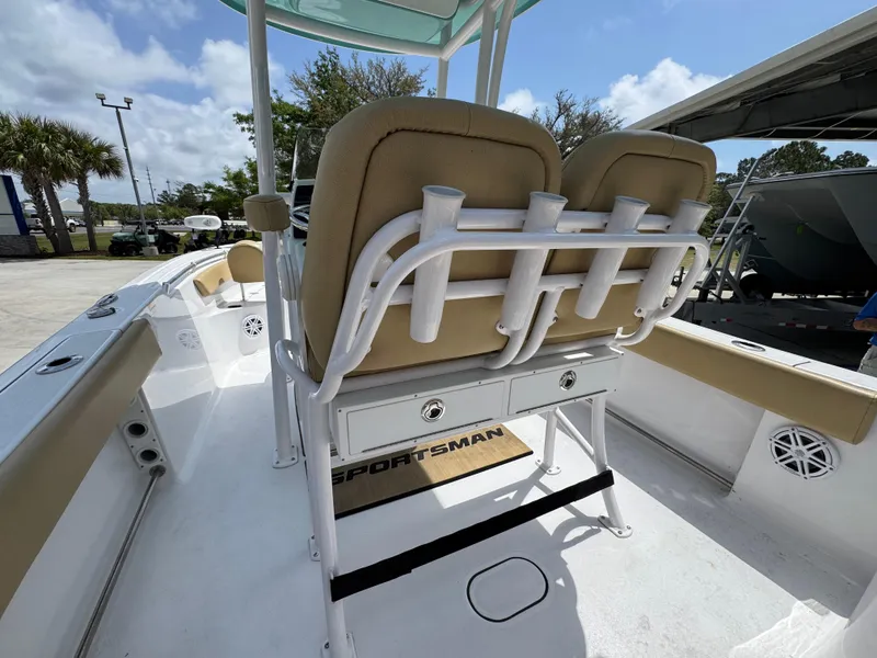 Slide: The Image of 2023 Sportsman Open 212 Center Console boat interior with seating and rod holders. - 36