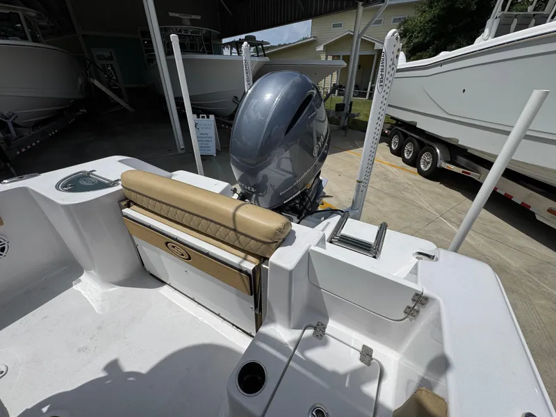 Slide: The Image of 2023 Sportsman Open 212 Center Console boat interior with engine and seating. - 38