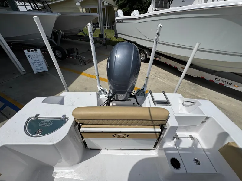 Slide: The Image of 2023 Sportsman Open 212 Center Console boat with motor, docked outdoors. - 39