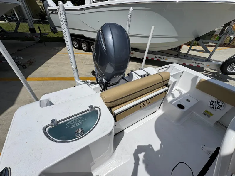 Slide: The Image of 2023 Sportsman Open 212 Center Console boat interior with seating and motor. - 40