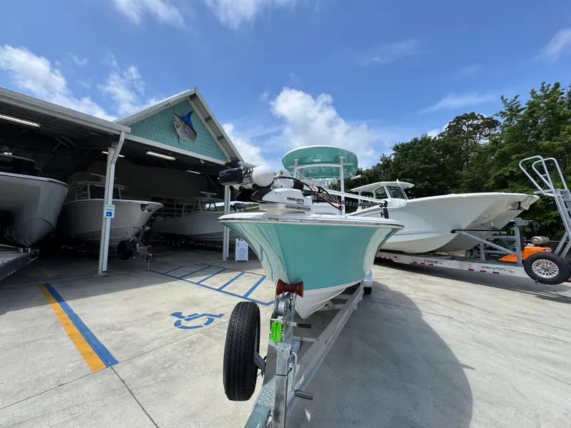 Slide: The Image of 2023 Sportsman Open 212 Center Console boat on trailer at dealership. - 6