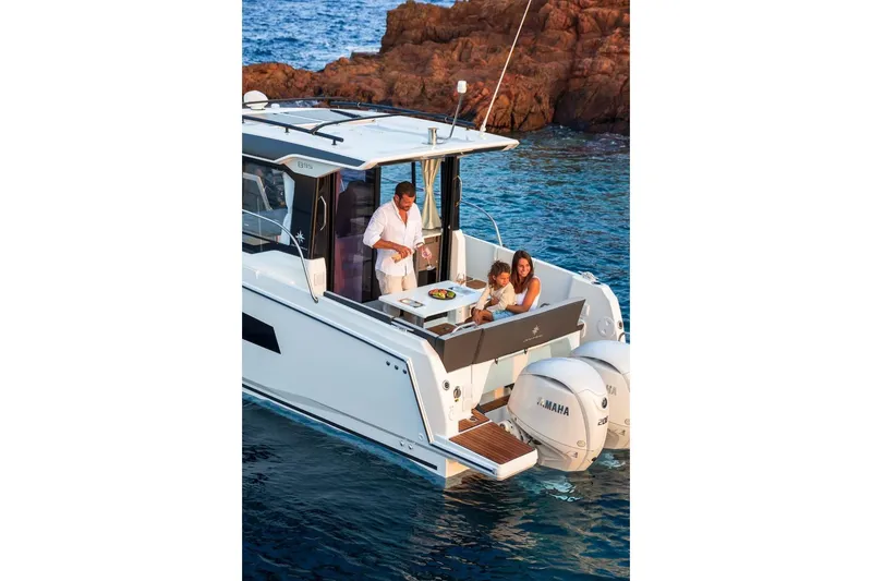 Slide: The Image of 2025 Jeanneau NC 895 Series 2 boat with people enjoying a meal on deck. - 36