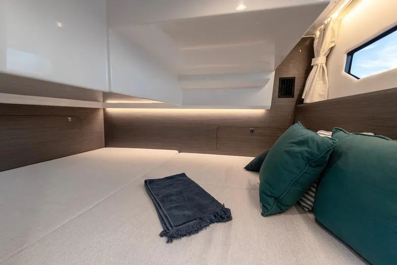 Slide: The Image of Luxurious cabin interior of 2025 Jeanneau NC 895 Series 2 with cozy bedding. - 63