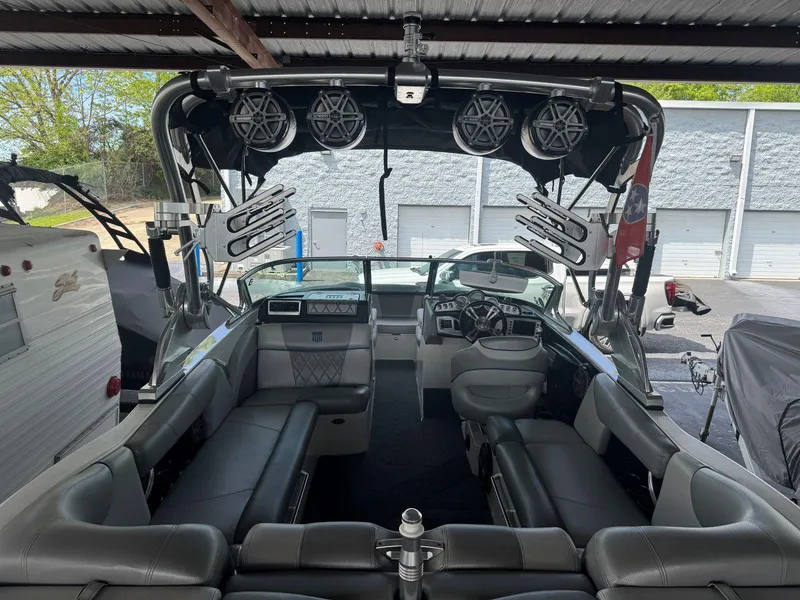 Slide: The Image of 2015 MasterCraft X23 boat interior with premium seating and advanced audio system. - 11