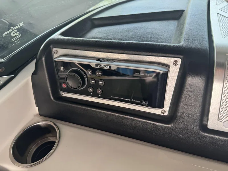 Slide: The Image of 2015 MasterCraft X23 dashboard with Fusion marine stereo system. - 26
