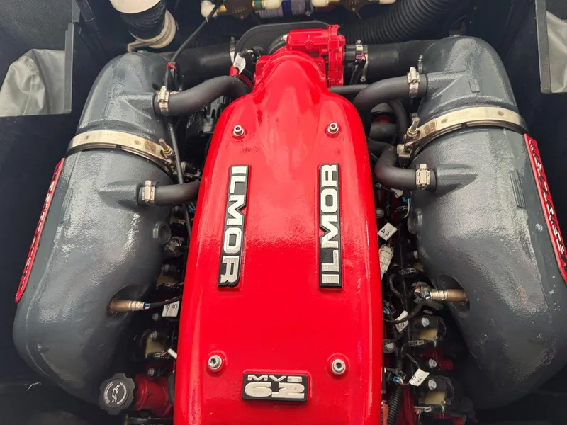 Slide: The Image of 2015 MasterCraft X23 Ilmor engine, red and gray components, top view. - 45