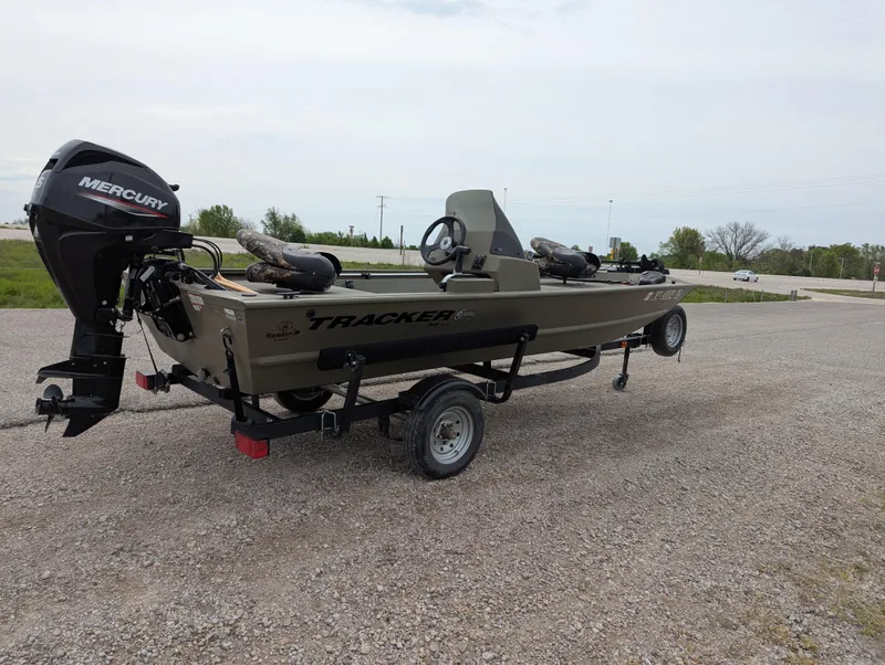 Slide: The Image of 2022 Tracker Grizzly 1648 SC boat with Mercury engine on a trailer. - 33
