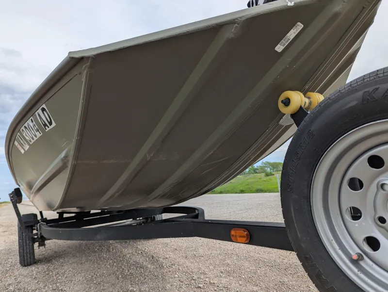 Slide: The Image of 2022 Tracker Grizzly 1648 SC boat on trailer, close-up view. - 36