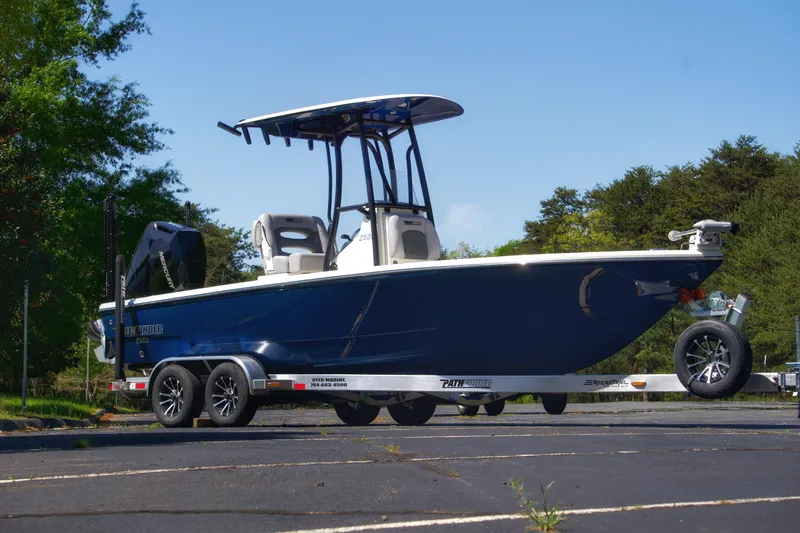 The Image of 2025 Pathfinder 2500 Hybrid boat on trailer, parked outdoors, side view. - 0