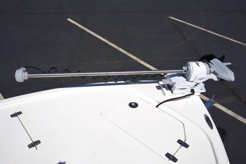 Slide: The Image of Trolling motor mounted on a 2025 Pathfinder 2500 Hybrid boat in a parking lot. - 13