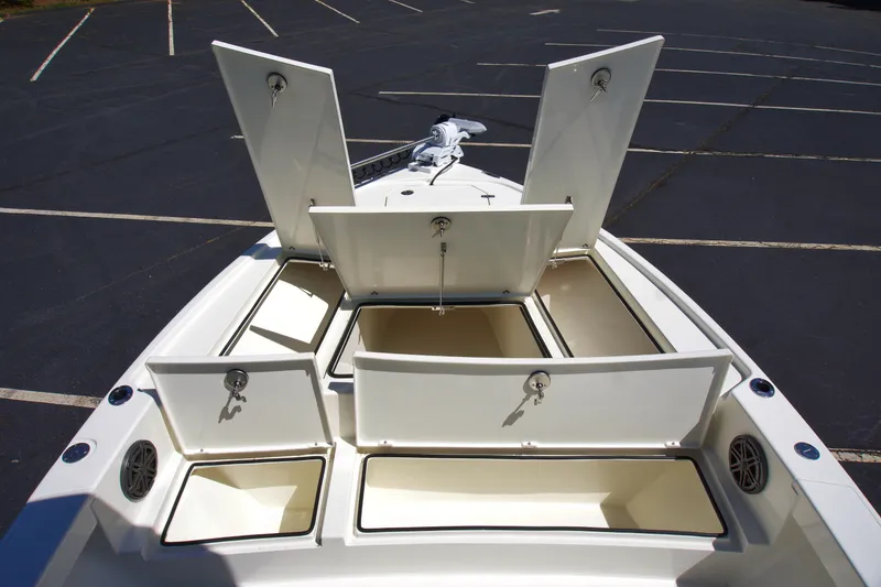 Slide: The Image of 2025 Pathfinder 2500 Hybrid boat with open storage compartments on deck. - 20