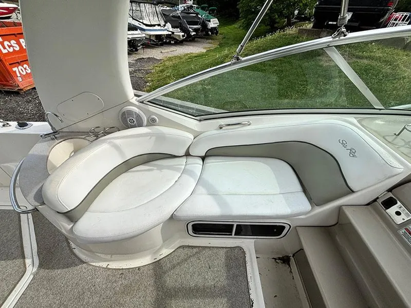 Slide: The Image of 2007 Sea Ray 260 Sundancer interior with white seating and sleek design. - 15