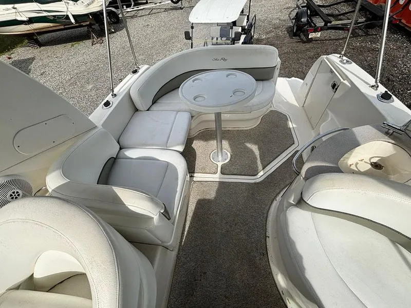 Slide: The Image of 2007 Sea Ray 260 Sundancer boat interior with seating and table, showcasing luxury and comfort. - 17