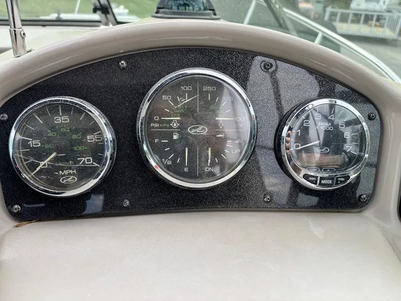 Slide: The Image of Dashboard of a 2007 Sea Ray 260 Sundancer boat with speedometer and gauges. - 3