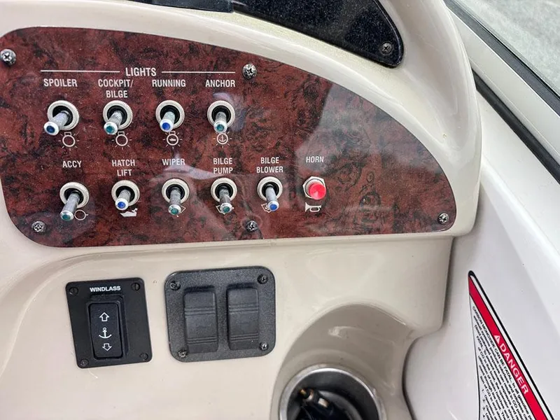 Slide: The Image of Control panel of a 2007 Sea Ray 260 Sundancer boat with various switches and labels. - 5