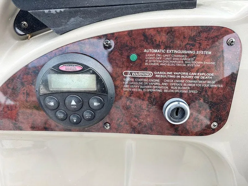 Slide: The Image of Control panel of a 2007 Sea Ray 260 Sundancer with safety warnings and automatic extinguishing system. - 6