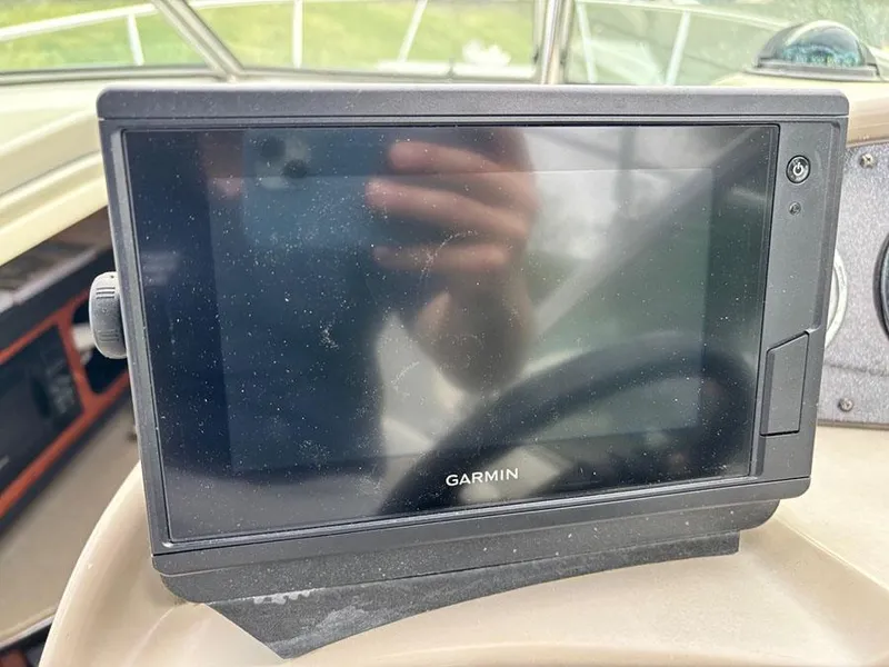 Slide: The Image of Garmin GPS device on 2007 Sea Ray 260 Sundancer boat dashboard. - 7