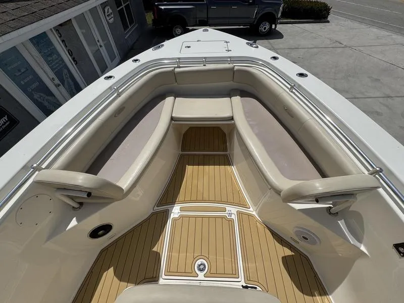 Slide: The Image of 2016 Cobia 296 Center Console boat with spacious seating and teak flooring. - 7