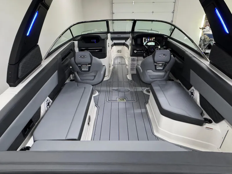 Slide: The Image of 2025 Chaparral 2870 SSX boat interior with sleek seating and modern dashboard design. - 10