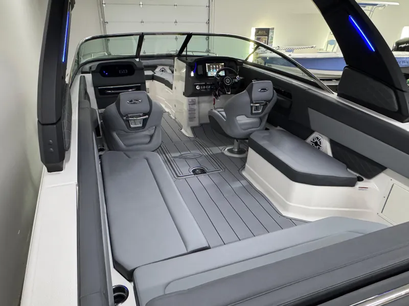Slide: The Image of 2025 Chaparral 2870 SSX boat interior with sleek seating and modern dashboard design. - 11