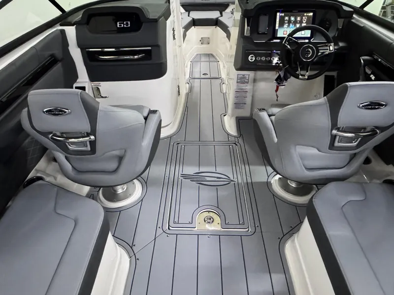 Slide: The Image of 2025 Chaparral 2870 SSX boat interior with modern seating and sleek dashboard design. - 14