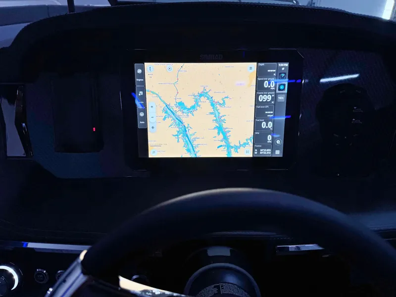 Slide: The Image of Dashboard of 2025 Chaparral 2870 SSX with navigation display. - 17