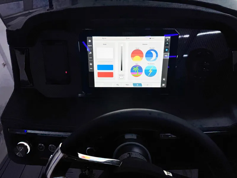 Slide: The Image of Dashboard of 2025 Chaparral 2870 SSX boat with touchscreen display and steering wheel. - 19