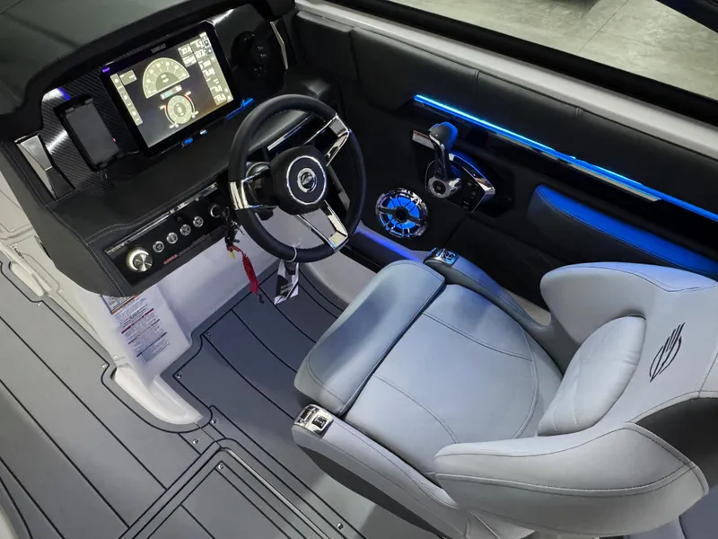 Slide: The Image of 2025 Chaparral 2870 SSX boat cockpit with modern steering and digital display. - 20