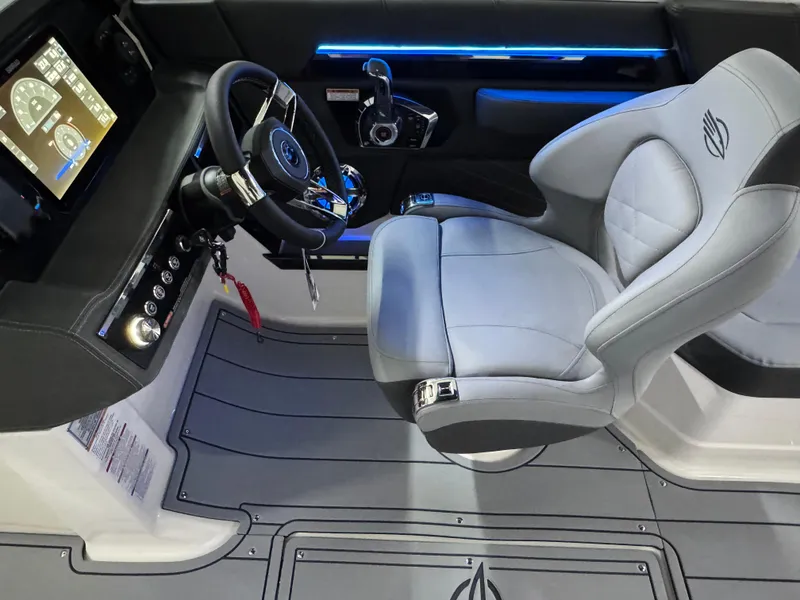 Slide: The Image of 2025 Chaparral 2870 SSX boat interior with modern steering and seating. - 21