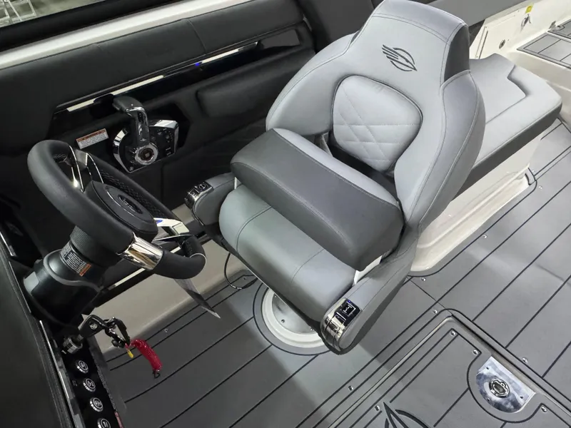 Slide: The Image of 2025 Chaparral 2870 SSX boat interior with sleek steering and luxurious seating. - 23
