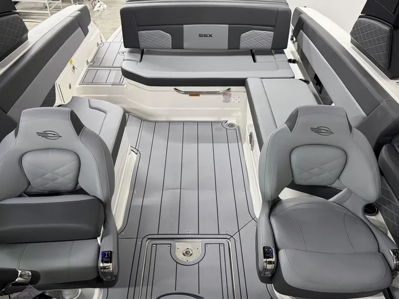 Slide: The Image of 2025 Chaparral 2870 SSX boat interior with gray seating and modern design. - 28