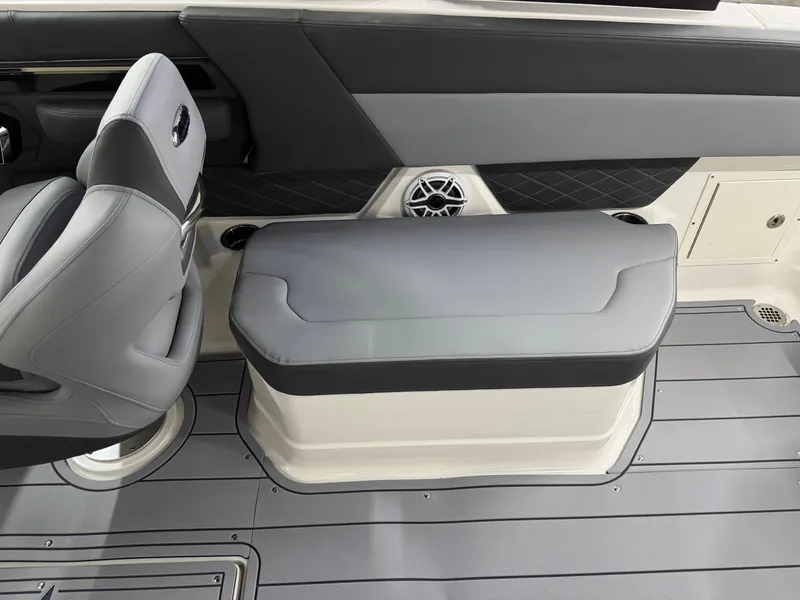 Slide: The Image of 2025 Chaparral 2870 SSX boat interior with gray seating and modern design. - 29