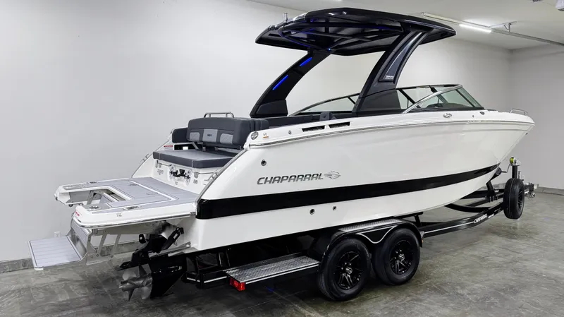 Slide: The Image of 2025 Chaparral 2870 SSX boat on trailer in showroom. - 3
