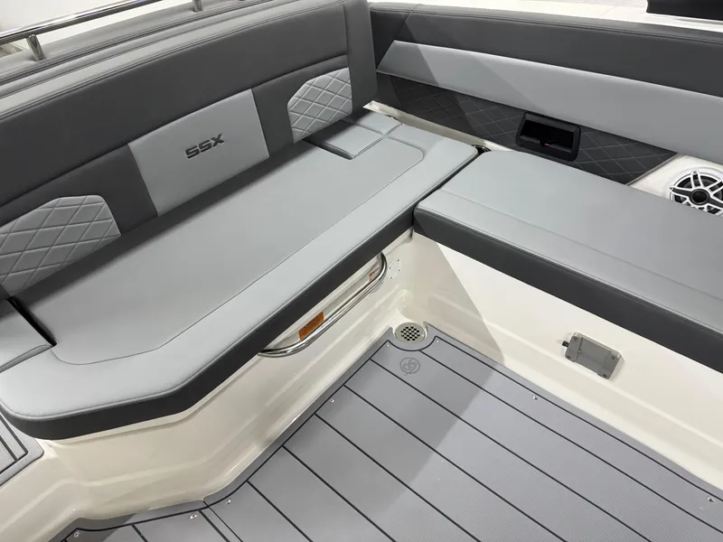 Slide: The Image of 2025 Chaparral 2870 SSX boat interior with gray seating and modern design. - 32