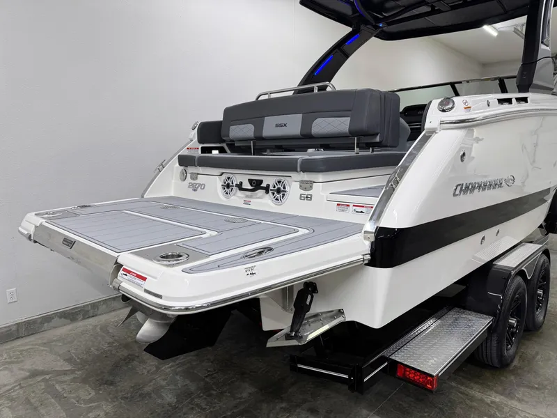 Slide: The Image of 2025 Chaparral 2870 SSX boat with extended swim platform and dual axle trailer. - 4