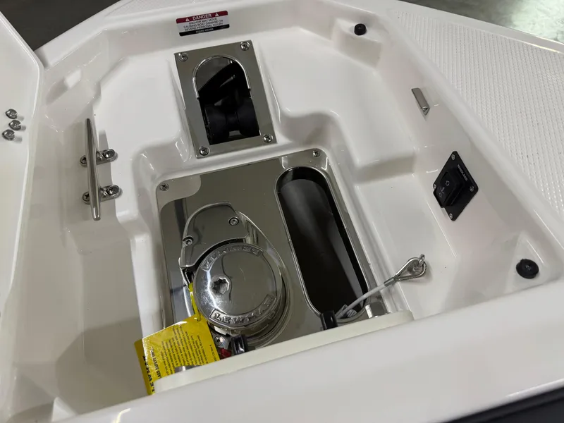 Slide: The Image of 2025 Chaparral 2870 SSX boat anchor compartment with stainless steel fittings. - 43