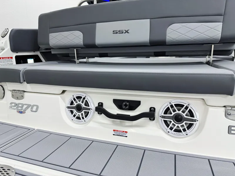 Slide: The Image of 2025 Chaparral 2870 SSX boat with sleek seating and modern audio system. - 46