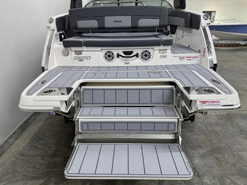 Slide: The Image of 2025 Chaparral 2870 SSX boat with extended swim platform and seating area. - 6
