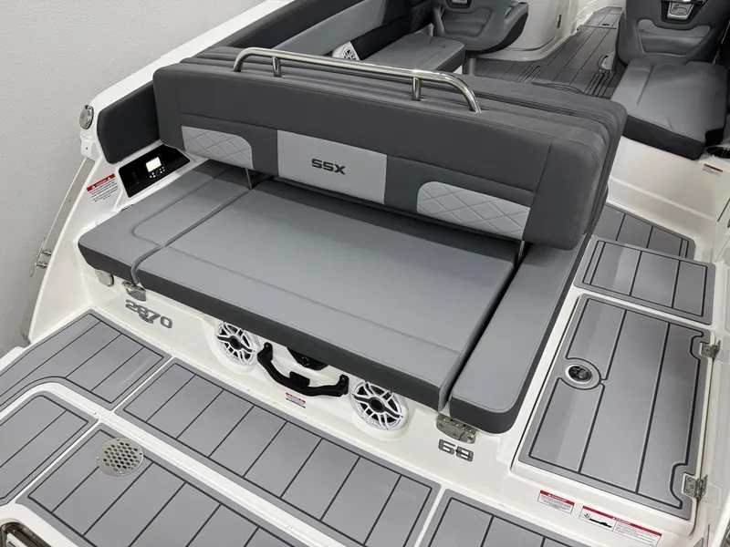Slide: The Image of 2025 Chaparral 2870 SSX boat interior with gray seating and deck details. - 7