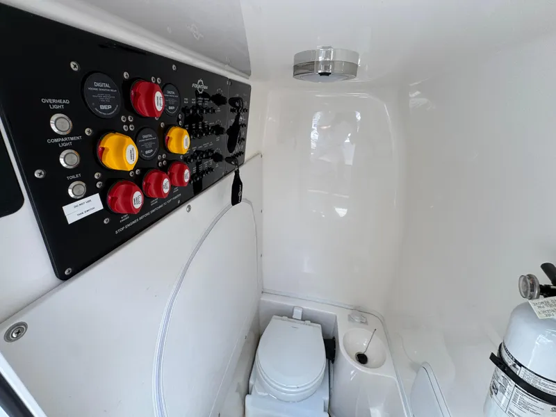 Slide: The Image of Interior of 2021 Fountain 38TE boat with control panel and compact toilet. - 29