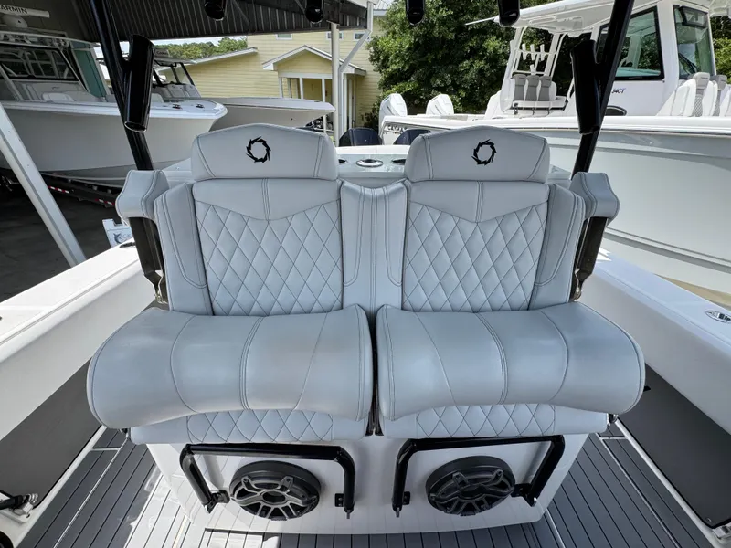 Slide: The Image of 2021 Fountain 38TE boat interior with luxurious quilted seating and built-in speakers. - 31