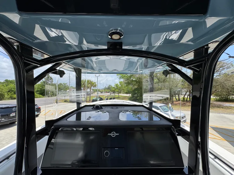 Slide: The Image of Interior view of 2021 Fountain 38TE boat cockpit with modern navigation system. - 34