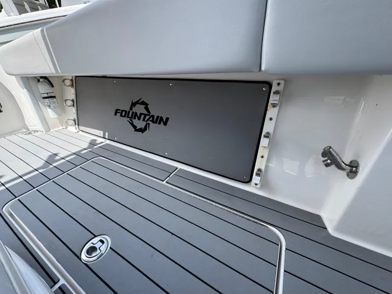 Slide: The Image of 2021 Fountain 38TE boat deck with logo, featuring sleek gray flooring. - 35