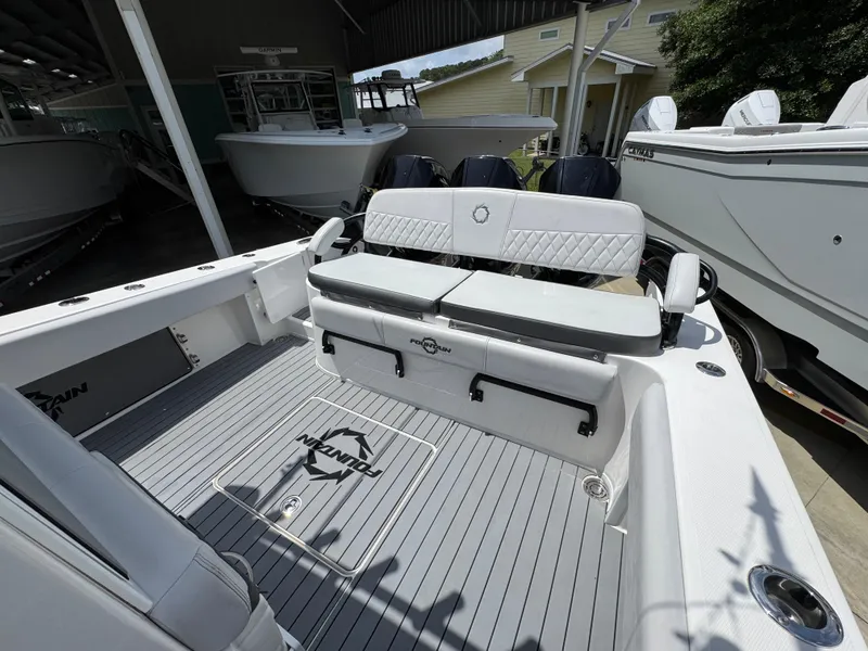 Slide: The Image of 2021 Fountain 38TE boat interior with cushioned seating and sleek deck design. - 39