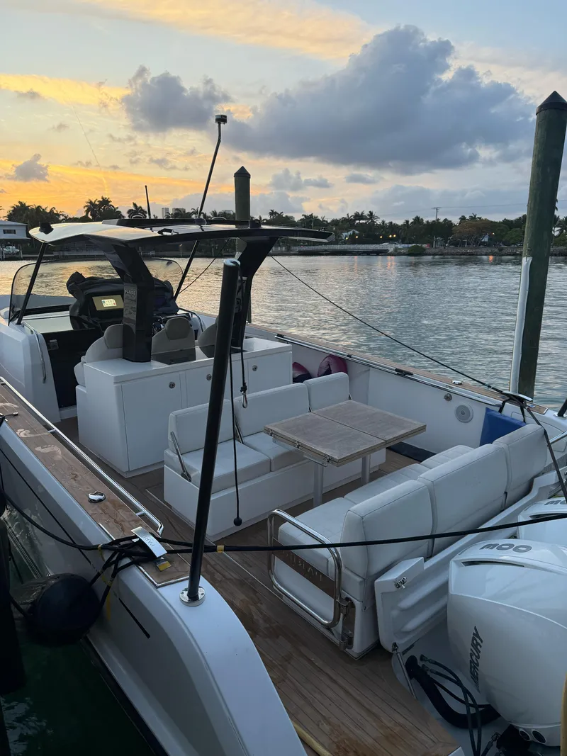 Slide: The Image of 2022 Pardo Yachts 38 docked at sunset, featuring sleek design and spacious seating. - 4